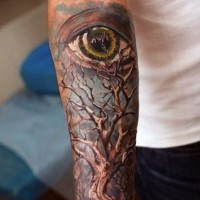 Hypnotizing painted very detailed 3D colored lonely tree with big eye tattoo on forearm