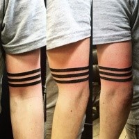 Identical black ink biceps tattoo of straight lines