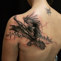 Illustrative style black and white back tattoo of crow with lettering