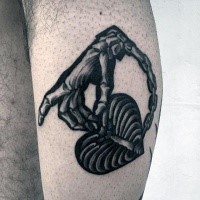 Illustrative style black and white leg tattoo of chained bone hand and heart