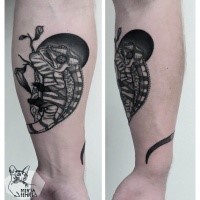Illustrative style black ink arm tattoo of chameleon