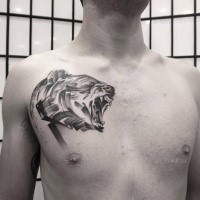 Illustrative style black ink chest tattoo of roaring bear