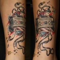 Illustrative style colored ankle tattoo of old music tape