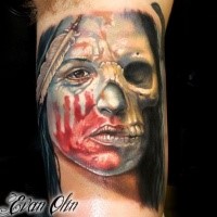Illustrative style colored arm tattoo of Indian half woman half skull portrait