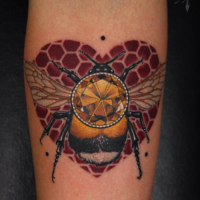 Illustrative style colored arm tattoo of bee with jewelry