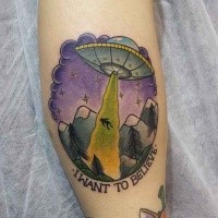 Illustrative style colored arm tattoo of alien ship stealing human with lettering