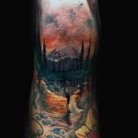 Illustrative style colored arm tattoo of mountain forest