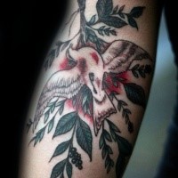 Illustrative style colored arm tattoo of wounded bird and tree branch