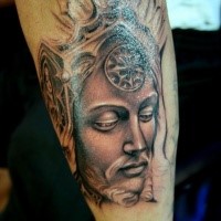 Illustrative style colored arm tattoo of fantasy man face