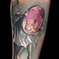 Illustrative style colored arm tattoo of creepy woman with mirror