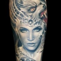 Illustrative style colored arm tattoo of woman with demonic helmet