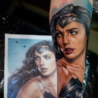 Illustrative style colored arm tattoo of beautiful Wonder woman