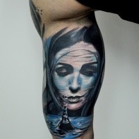 Illustrative style colored arm tattoo of mystical woman with sea beacon