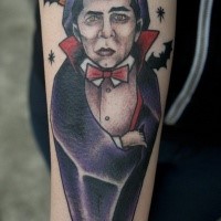 Illustrative style colored arm tattoo of Dracula with bats