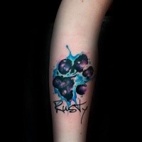 Illustrative style colored arm tattoo of animal paw with lettering