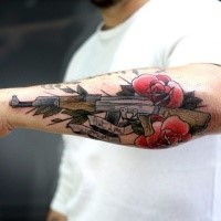 Illustrative style colored arm tattoo of AK rifle with flowers and lettering