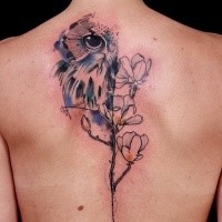 Illustrative style colored back tattoo of owl with flowers