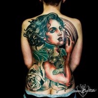 Illustrative style colored back tattoo of woman with cat