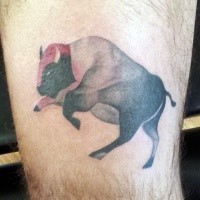 Illustrative style colored bull tattoo on arm