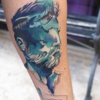 Illustrative style colored forearm tattoo of man with beard and bird