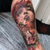 Illustrative style colored forearm tattoo of tiger and woman face