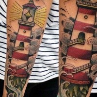 Illustrative style colored forearm tattoo of lighthouse and waves