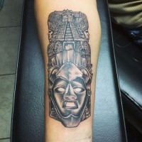 Illustrative style colored forearm tattoo of big statue