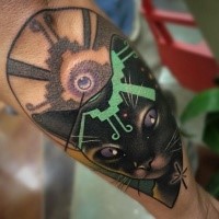 Illustrative style colored forearm tattoo of mystical cat