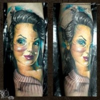 illustrative style colored forearm tattoo of cute woman doll