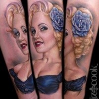Illustrative style colored forearm tattoo of cute woman with blue flower