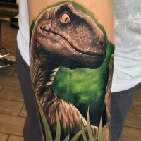 Illustrative style colored forearm tattoo of dinosaur