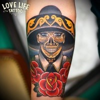 Illustrative style colored forearm tattoo of Mexican skeleton with rose