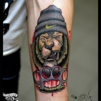 Illustrative style colored forearm tattoo of lion thug
