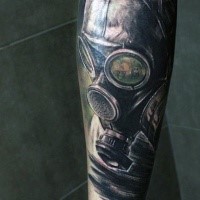 Illustrative style colored gas mask tattoo on forearm