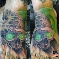 Illustrative style colored human skull tattoo on foot with radiation symbol