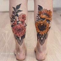 Illustrative style colored leg tattoo of beautiful flowers