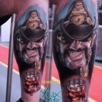 Illustrative style colored leg tattoo of smiling man with hat and glass of whiskey