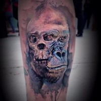 Illustrative style colored leg tattoo of bug gorilla with skull