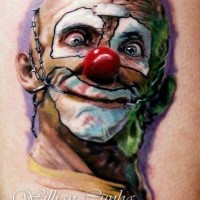 Illustrative style colored maniac clown tattoo