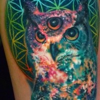 Illustrative style colored mystical owl tattoo on thigh with unusual symbol