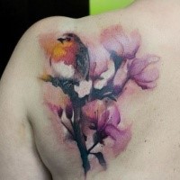 Illustrative style colored scapular tattoo of little bird with flowers