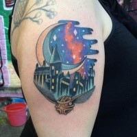 Illustrative style colored shoulder tattoo of magical school