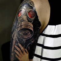 Illustrative style colored shoulder tattoo of mystical man in gas mask