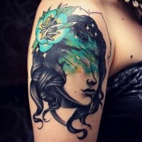 Illustrative style colored shoulder tattoo of woman with flower