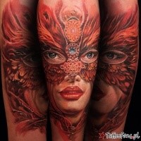 Illustrative style colored shoulder tattoo of woman portrait with butterfly like mask