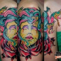 Illustrative style colored shoulder tattoo of Medusa head with rose