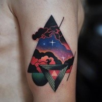 Illustrative style colored shoulder tattoo of triangle and symbol