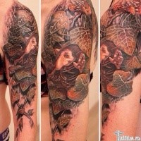 Illustrative style colored shoulder tattoo of little gnome and leaves
