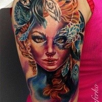 Illustrative style colored shoulder tattoo of woman with mask and flowers