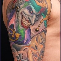Illustrative style colored shoulder tattoo of evil Joker with mask